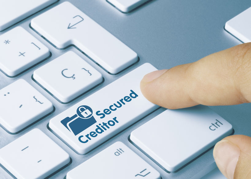 Secured Creditor – Inscription on Blue Keyboard Key.